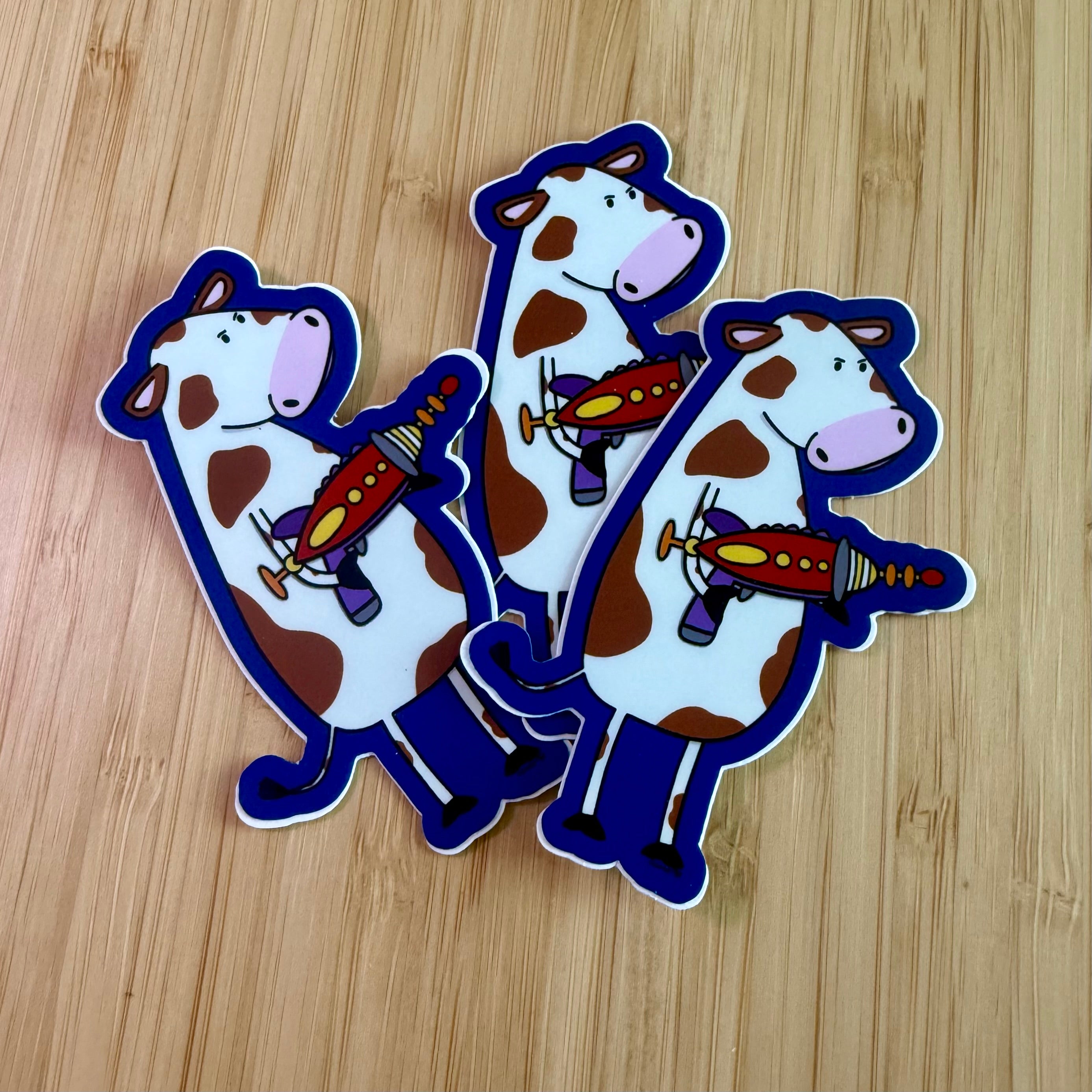 Cow with a ray gun sticker