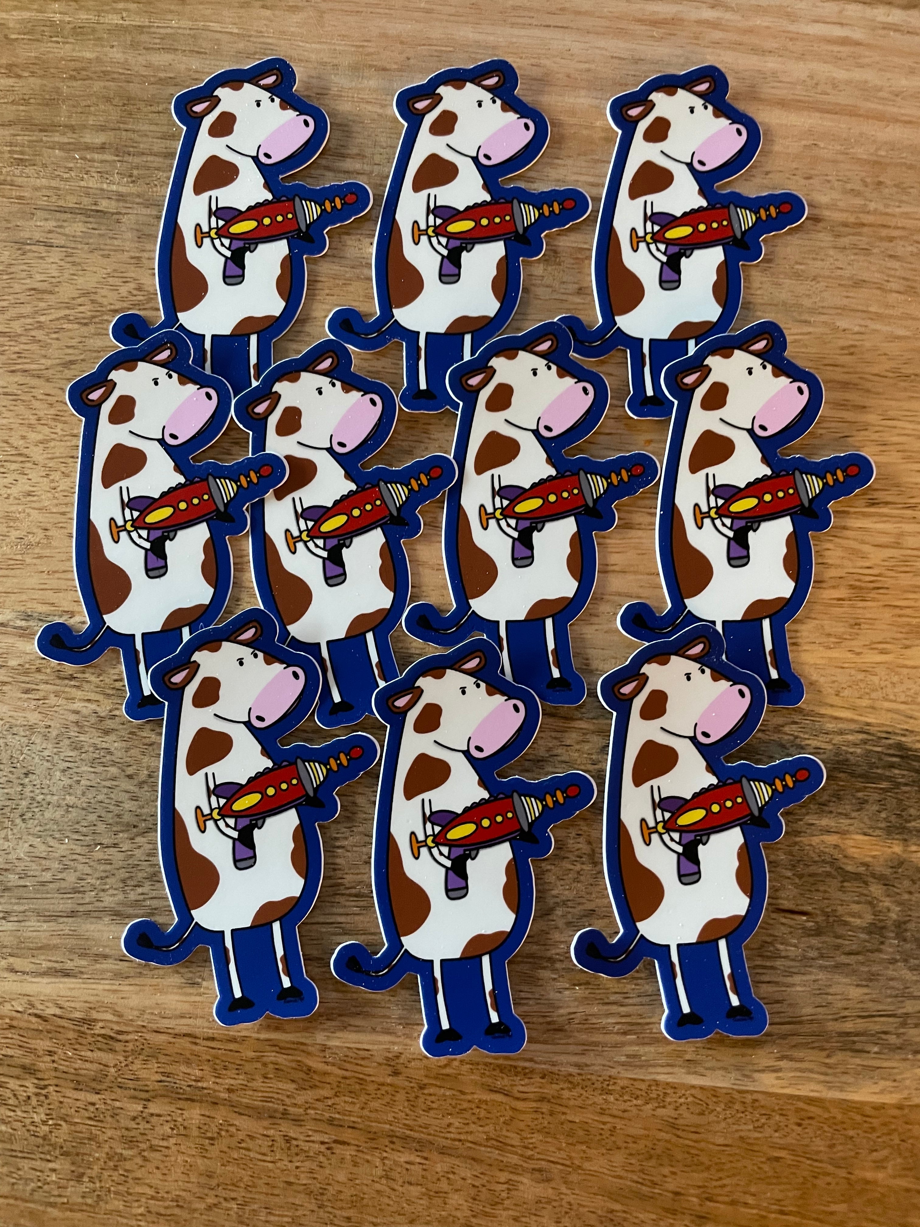 Cow with a ray gun sticker
