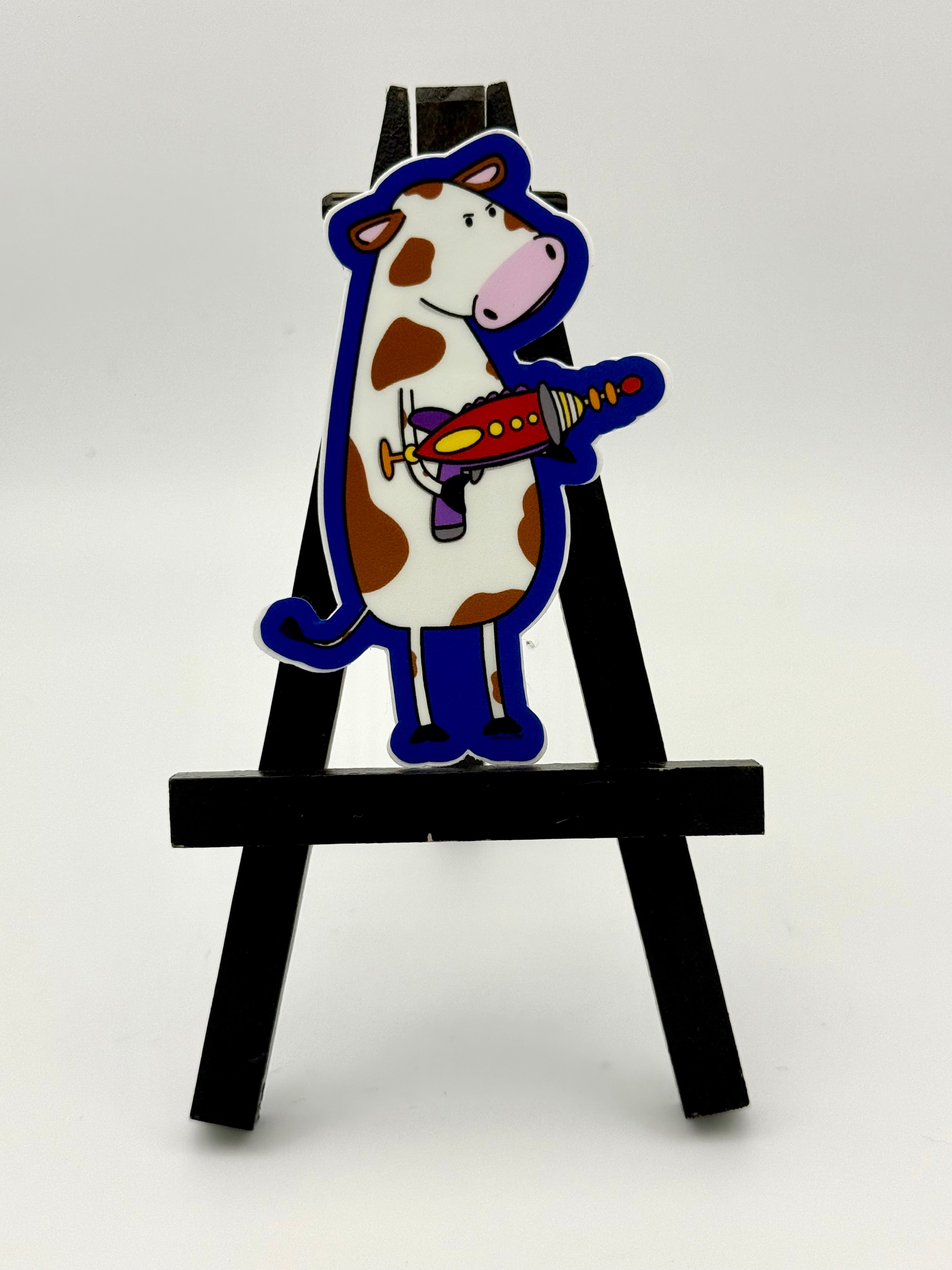 Cow with a ray gun sticker