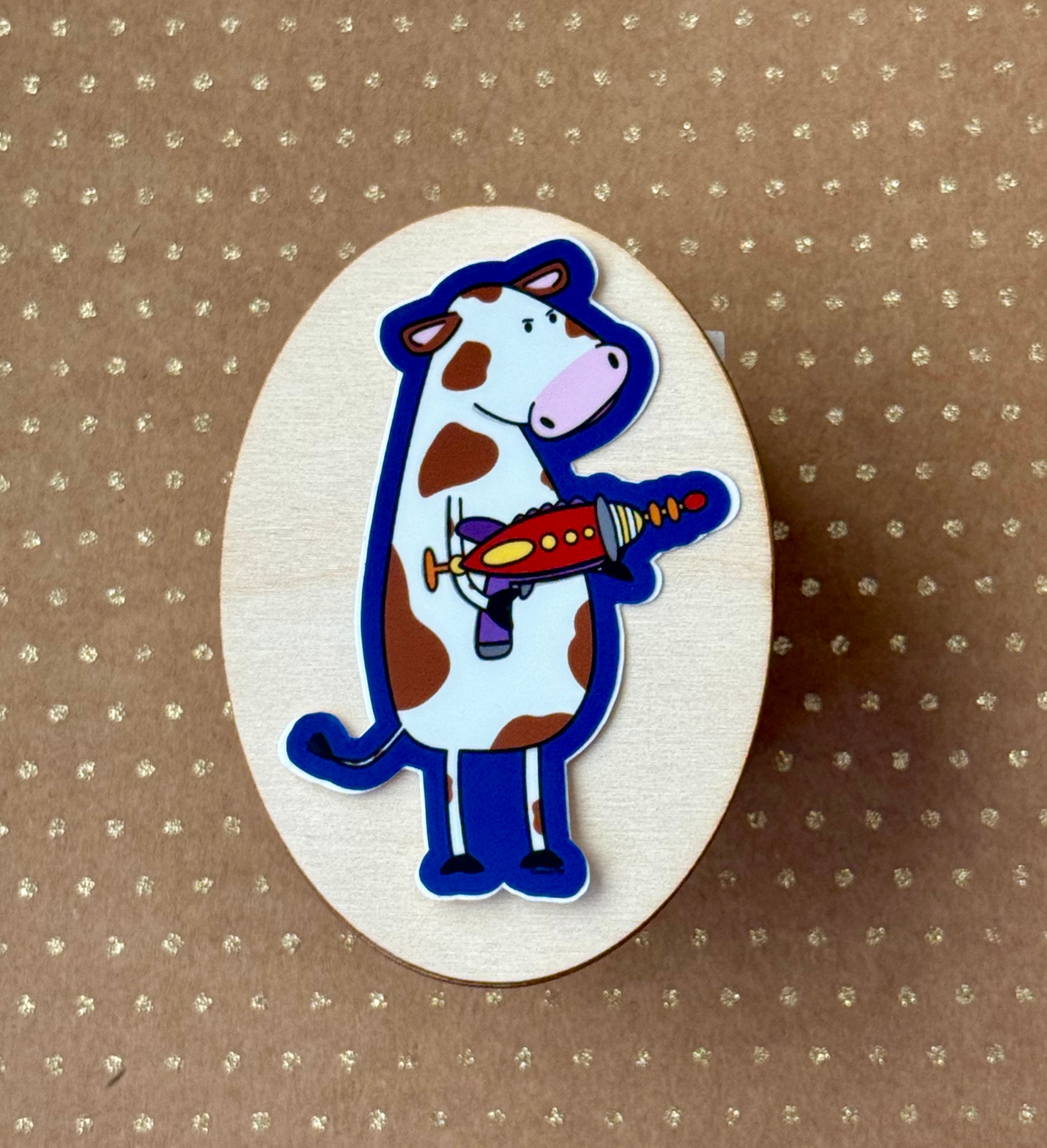 Cow with a ray gun sticker