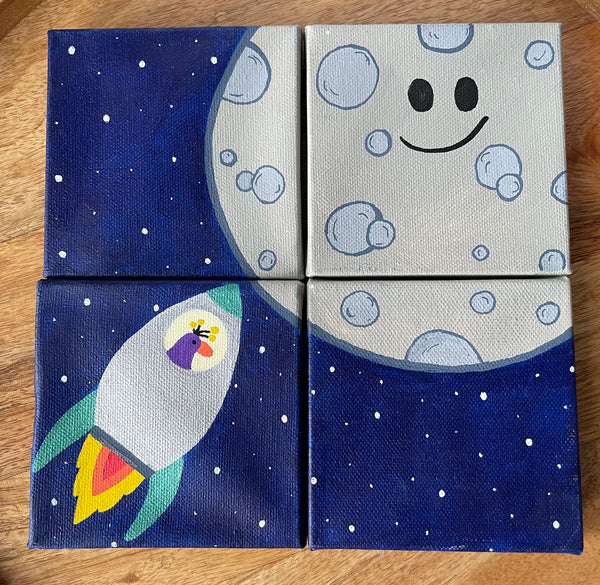 four small mini canvases with one hand painted image of the moon and rocketship with a small bird at the helm