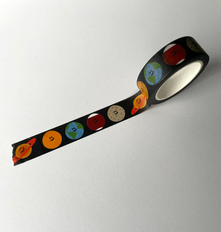 black washi tape with the moon, sun, earth, mars and saturn on it - all smiling
